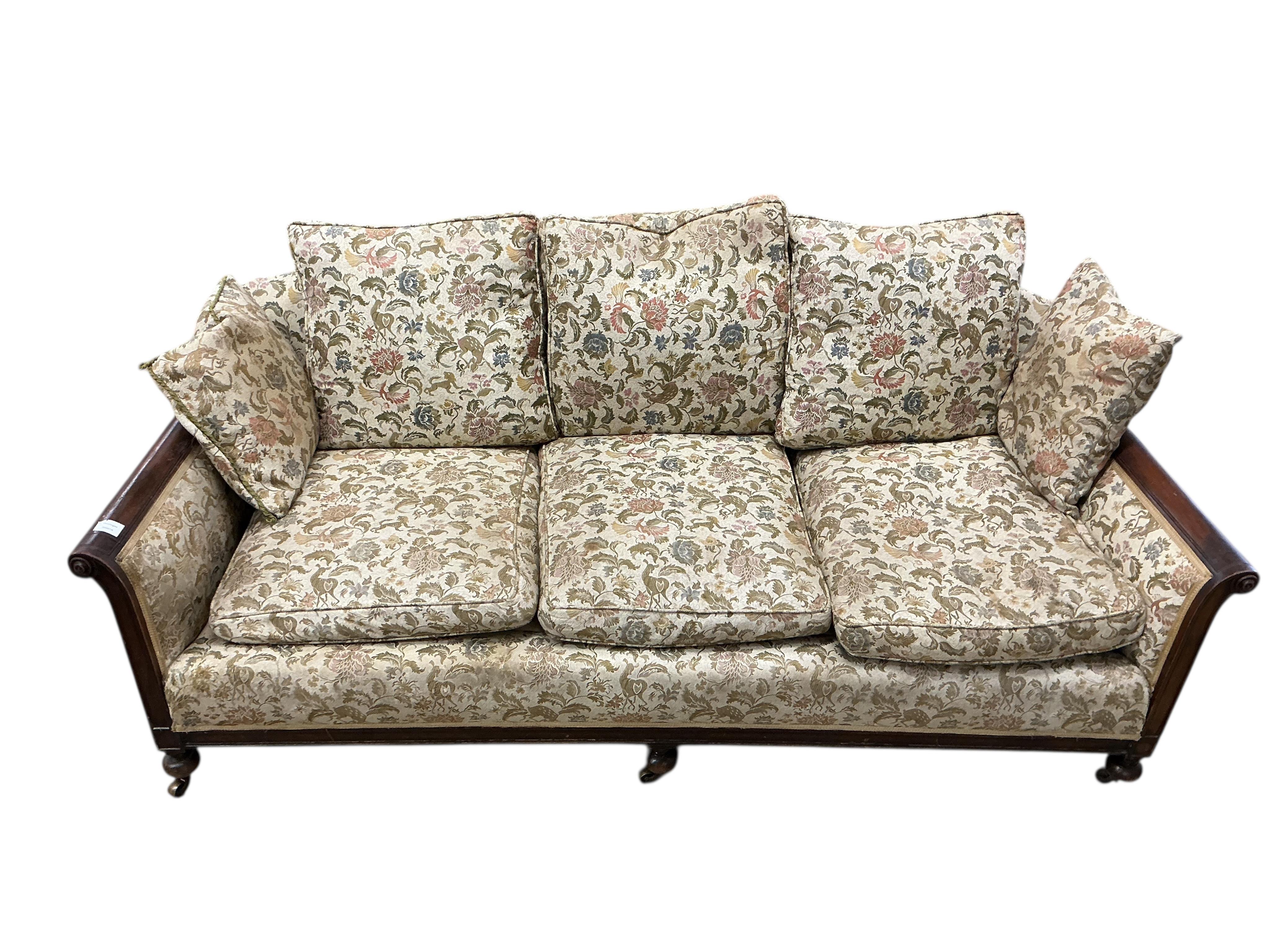 An early 20th century mahogany bergere settee, now upholstered, width 196cm, depth 92cm, height 84cm